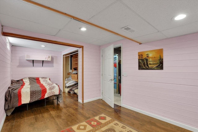 7312 E Euclid Ave, Spokane Valley, WA 99212 - bedroom featuring wood walls, dark wood-style flooring, recessed lighting, and baseboards