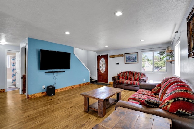 7312 E Euclid Ave, Spokane Valley, WA 99212 - living room featuring a textured ceiling, wood finished floors, stairs, recessed lighting, and baseboards