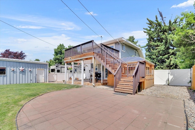 7312 E Euclid Ave, Spokane Valley, WA 99212 - rear view of property with a gate, a deck, a patio, and stairs