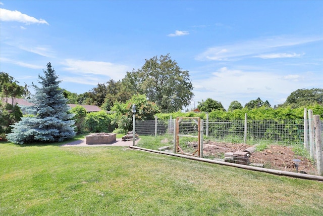 7312 E Euclid Ave, Spokane Valley, WA 99212 - view of grassy yard featuring an outdoor fire pit