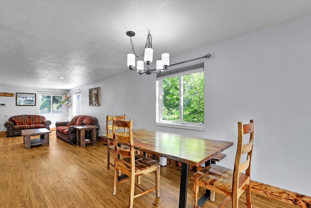7312 E Euclid Ave, Spokane Valley, WA 99212 - dining area with wood finished floors and a chandelier