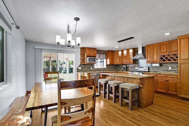 7312 E Euclid Ave, Spokane Valley, WA 99212 - dining area featuring a chandelier, wood finished floors, a textured ceiling, and recessed lighting