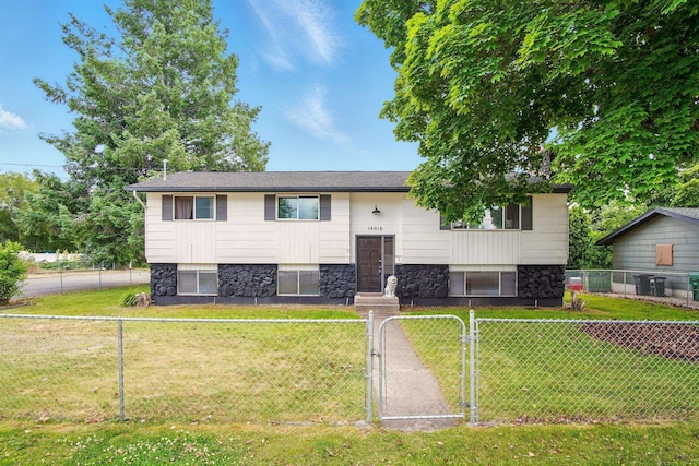 14018 E Valleyway Ave, Spokane, WA 99216 - bi-level home featuring a gate and stone siding
