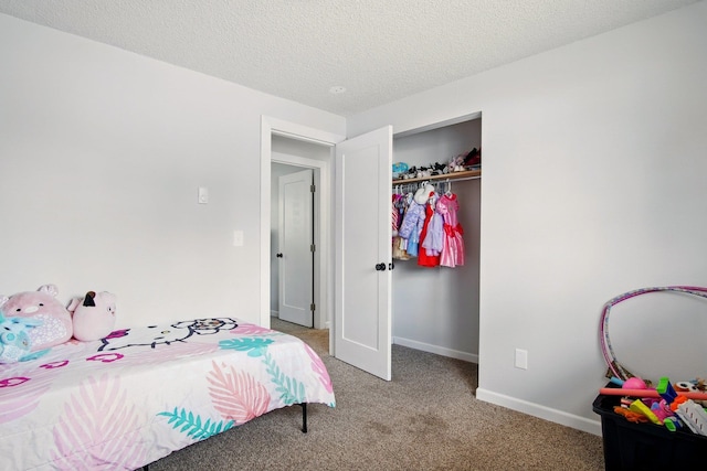 14018 E Valleyway Ave, Spokane, WA 99216 - bedroom with light colored carpet, a closet, baseboards, and a textured ceiling