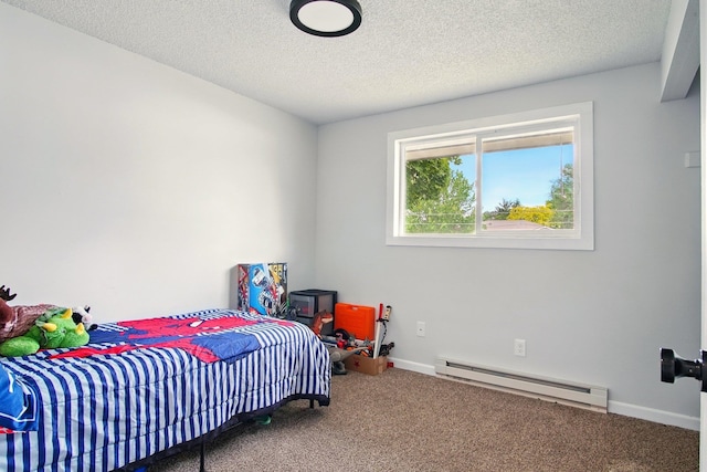 14018 E Valleyway Ave, Spokane, WA 99216 - carpeted bedroom featuring baseboard heating, baseboards, and a textured ceiling