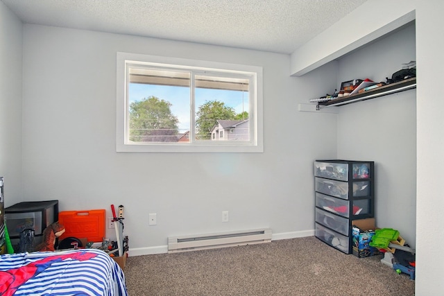 14018 E Valleyway Ave, Spokane, WA 99216 - carpeted bedroom featuring a baseboard radiator, a textured ceiling, and baseboards