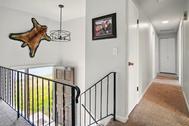 14018 E Valleyway Ave, Spokane, WA 99216 - hallway featuring carpet floors, baseboards, and an upstairs landing