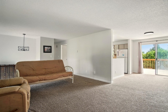 14018 E Valleyway Ave, Spokane, WA 99216 - carpeted living area with a textured ceiling and baseboards