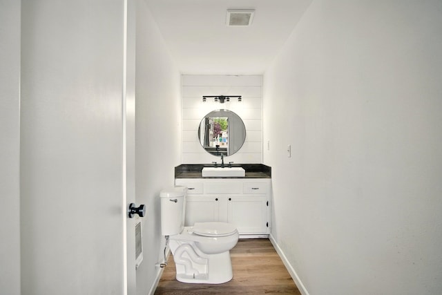 14018 E Valleyway Ave, Spokane, WA 99216 - bathroom with wood finished floors, toilet, vanity, and baseboards