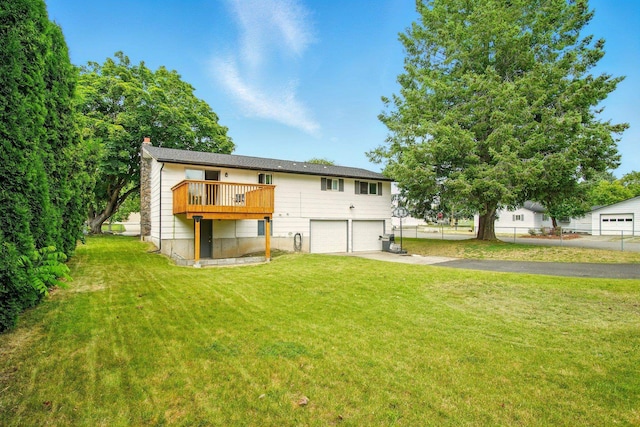 14018 E Valleyway Ave, Spokane, WA 99216 - back of property featuring a garage, a chimney, driveway, a yard, and a deck