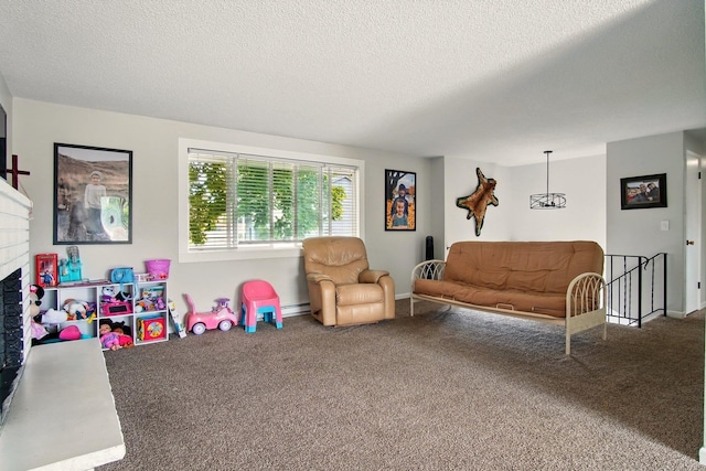 14018 E Valleyway Ave, Spokane, WA 99216 - carpeted living room with a textured ceiling, a fireplace, a baseboard radiator, and baseboards