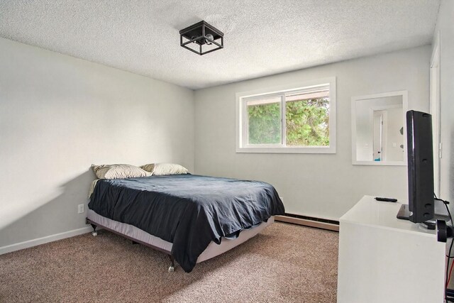 14018 E Valleyway Ave, Spokane, WA 99216 - carpeted bedroom with a baseboard heating unit, a textured ceiling, and baseboards
