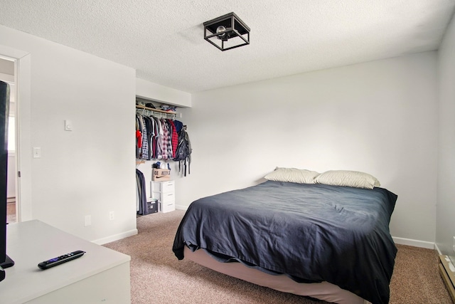 14018 E Valleyway Ave, Spokane, WA 99216 - carpeted bedroom featuring baseboards, a textured ceiling, and a closet