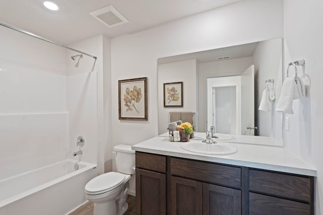 713 E L St, Deer Park, WA 99006 - full bathroom featuring vanity, toilet,  shower combination, and wood finished floors