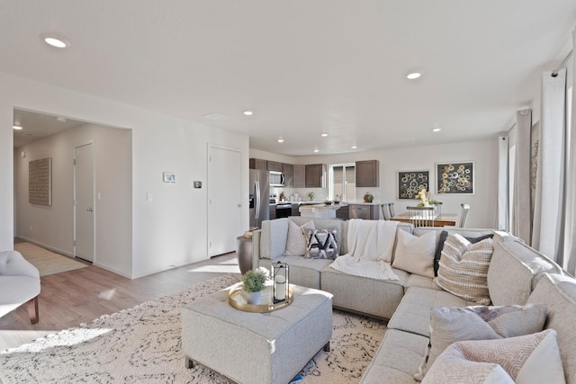 713 E L St, Deer Park, WA 99006 - living area featuring light wood-type flooring, recessed lighting, and baseboards