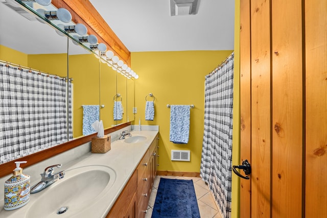 312 Pickett Rd, Ione, WA 99139 - bathroom with tile patterned floors, double vanity, baseboards, and a shower with shower curtain