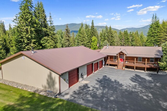 312 Pickett Rd, Ione, WA 99139 - view from above of property featuring a mountain backdrop and a heavily wooded area