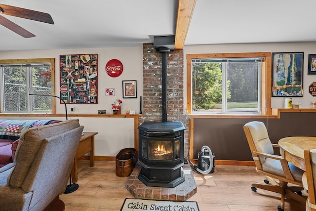312 Pickett Rd, Ione, WA 99139 - office featuring a wood stove, wood finished floors, a ceiling fan, and baseboards