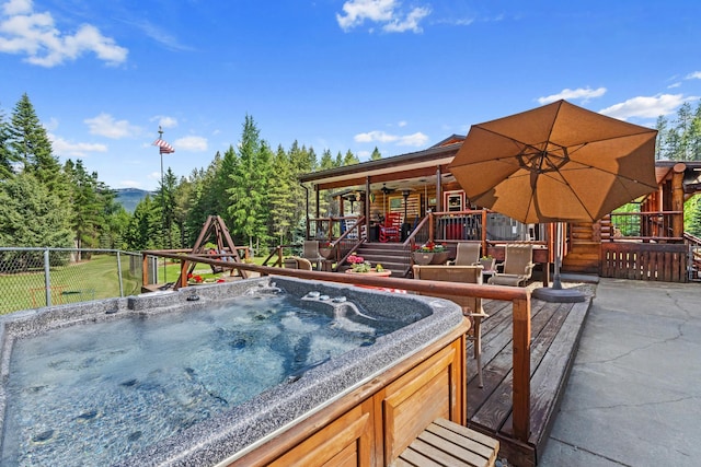 312 Pickett Rd, Ione, WA 99139 - view of patio featuring a hot tub, a wooden deck, and a ceiling fan