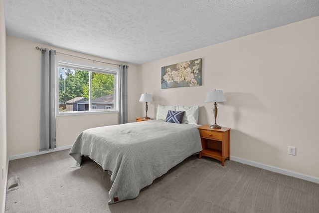 4238 E 24th Ave, Spokane, WA 99223 - carpeted bedroom with baseboards and a textured ceiling