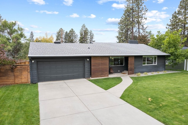 3812 S Tekoa St, Spokane, WA 99203 - ranch-style house with an attached garage, concrete driveway, a shingled roof, and a chimney