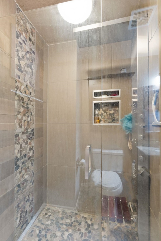 8710 N I Ct, Spokane, WA 99208 - full bathroom with a tile shower and toilet