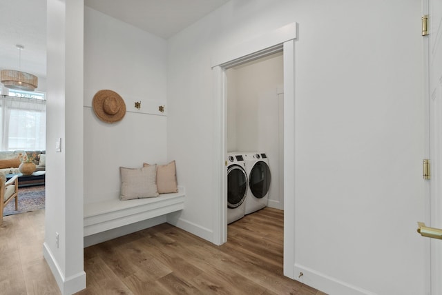 1217 E Granary Ct, Spokane, WA 99208 - laundry area featuring wood finished floors, baseboards, and washing machine and dryer