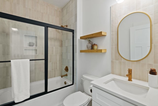 1217 E Granary Ct, Spokane, WA 99208 - full bath with bath / shower combo with glass door, vanity, tile walls, and toilet