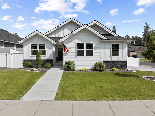 1217 E Granary Ct, Spokane, WA 99208 - view of front of house featuring board and batten siding, stone siding, and roof with shingles