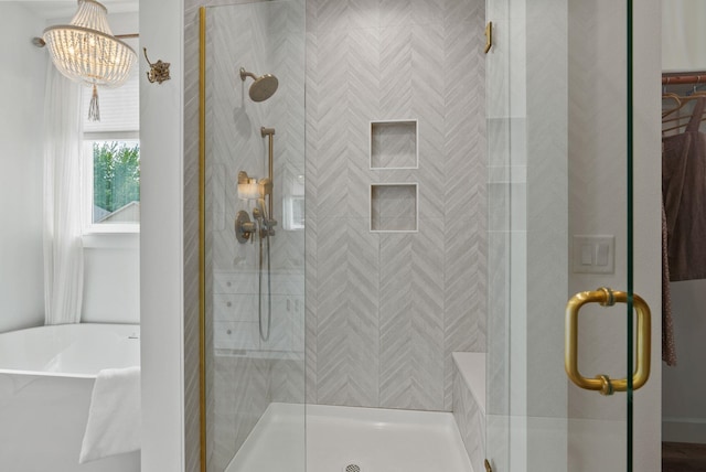 1217 E Granary Ct, Spokane, WA 99208 - full bath with a stall shower, a freestanding bath, and a chandelier