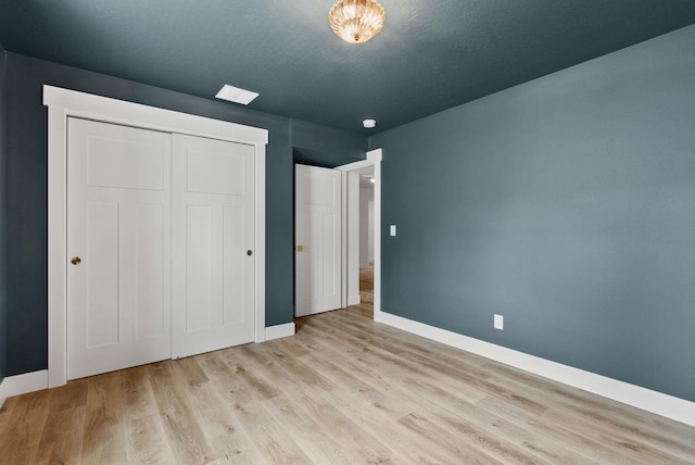 1217 E Granary Ct, Spokane, WA 99208 - unfurnished bedroom featuring baseboards, wood finished floors, and a closet