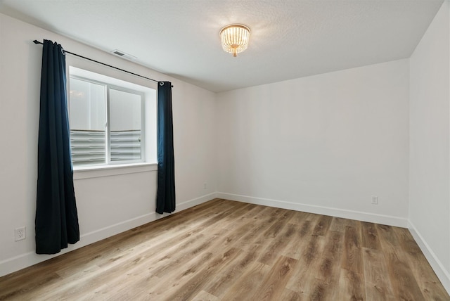 1217 E Granary Ct, Spokane, WA 99208 - empty room featuring wood finished floors and baseboards