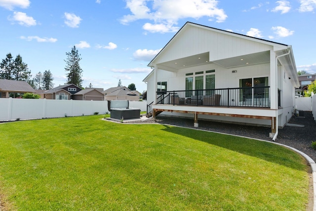 1217 E Granary Ct, Spokane, WA 99208 - rear view of house featuring a deck and a hot tub