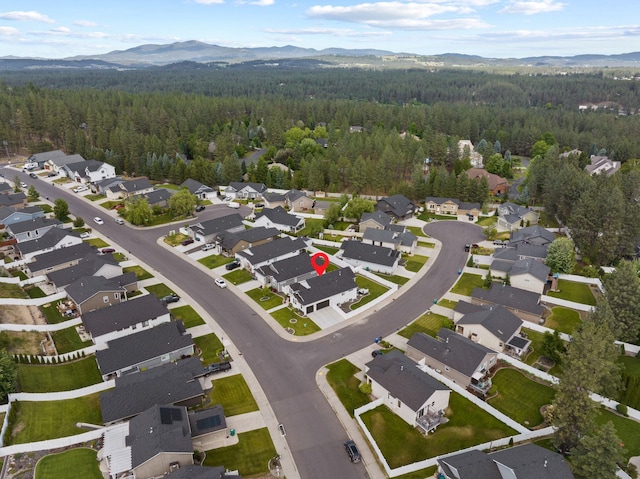 1217 E Granary Ct, Spokane, WA 99208 - view of property location with a heavily wooded area, a mountain backdrop, and nearby suburban area