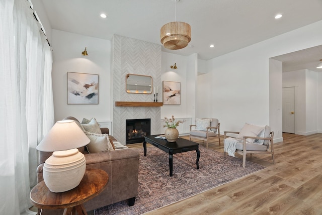 1217 E Granary Ct, Spokane, WA 99208 - living area with a tiled fireplace, wood finished floors, recessed lighting, and baseboards