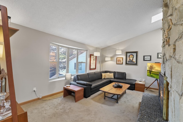 3014 S Perry St Unit 3014, Spokane, WA 99203 - living area with vaulted ceiling, carpet flooring, a textured ceiling, a fireplace, and baseboards