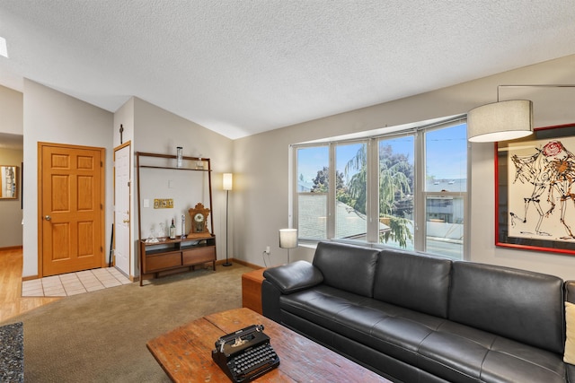 3014 S Perry St Unit 3014, Spokane, WA 99203 - living room with vaulted ceiling, carpet, and a textured ceiling