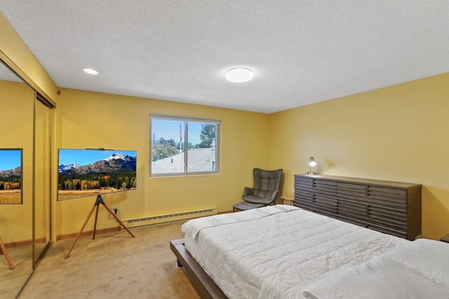 3014 S Perry St Unit 3014, Spokane, WA 99203 - bedroom with baseboard heating, carpet flooring, a textured ceiling, baseboards, and recessed lighting