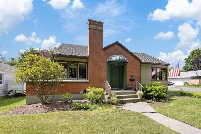904 E 40th Ave, Spokane, WA 99203 - view of front of home featuring a front yard, a chimney, and brick siding