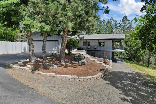 6913 S Ben Burr Rd, Spokane, WA 99223 - view of front of home with driveway and a chimney
