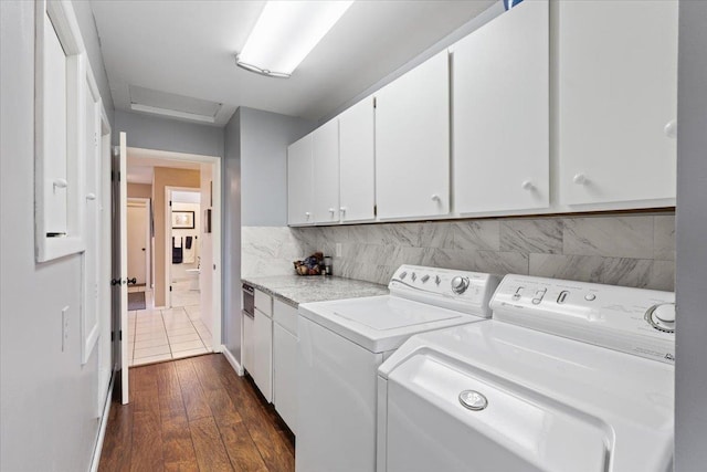 6913 S Ben Burr Rd, Spokane, WA 99223 - laundry room with cabinet space, washer and clothes dryer, attic access, and dark wood-style flooring