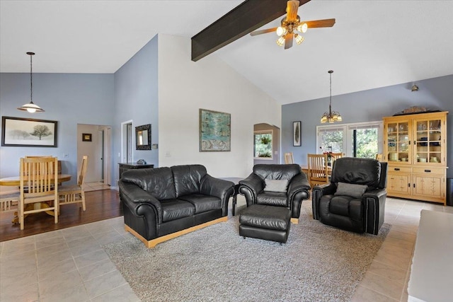 6913 S Ben Burr Rd, Spokane, WA 99223 - living area with high vaulted ceiling, light tile patterned floors, arched walkways, beamed ceiling, and a ceiling fan
