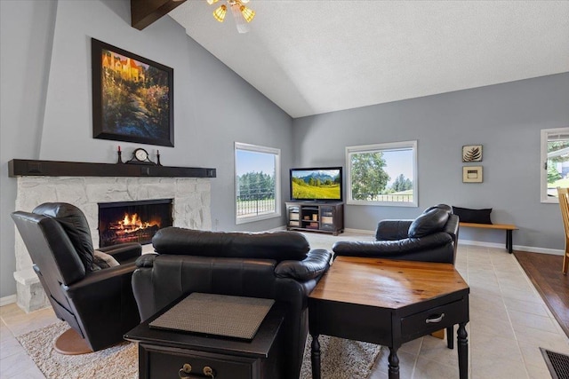 6913 S Ben Burr Rd, Spokane, WA 99223 - living room featuring healthy amount of natural light, a fireplace, tile patterned floors, high vaulted ceiling, and beamed ceiling