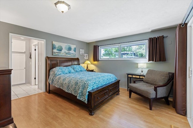 6913 S Ben Burr Rd, Spokane, WA 99223 - bedroom with light wood-type flooring and baseboards