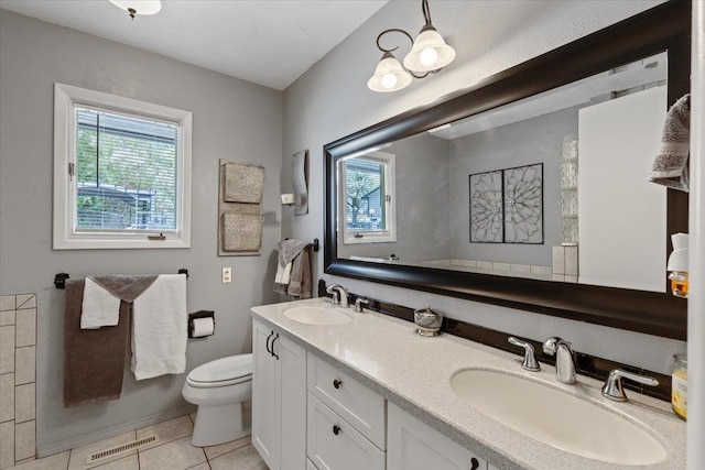 6913 S Ben Burr Rd, Spokane, WA 99223 - bathroom featuring plenty of natural light, tile patterned flooring, and double vanity