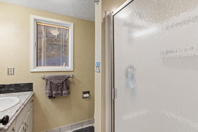 6913 S Ben Burr Rd, Spokane, WA 99223 - bathroom featuring a stall shower, vanity, and tile patterned floors