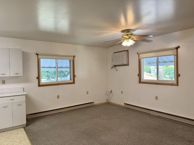 216 NW Cole Ave, Wilbur, WA 99185 - unfurnished room featuring baseboard heating, plenty of natural light, and ceiling fan