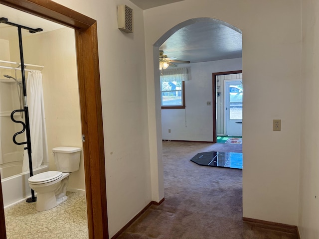 216 NW Cole Ave, Wilbur, WA 99185 - hall featuring arched walkways, baseboards, and carpet flooring