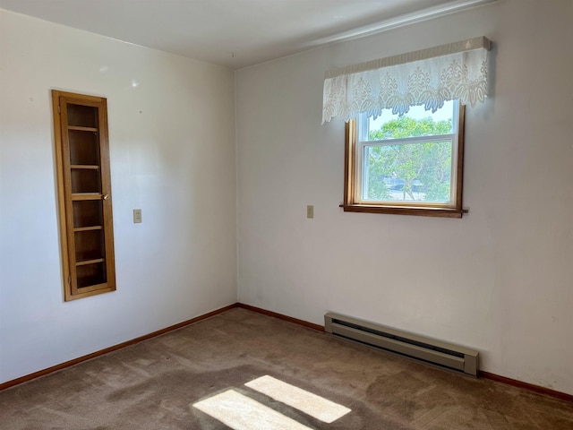 216 NW Cole Ave, Wilbur, WA 99185 - spare room with a baseboard radiator, carpet, and baseboards