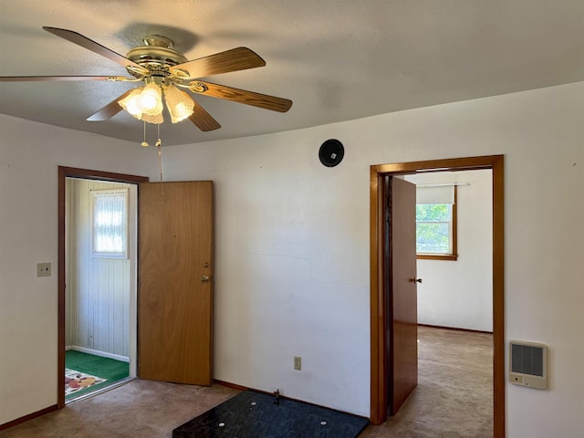 216 NW Cole Ave, Wilbur, WA 99185 - carpeted spare room with plenty of natural light, baseboards, heating unit, and a ceiling fan
